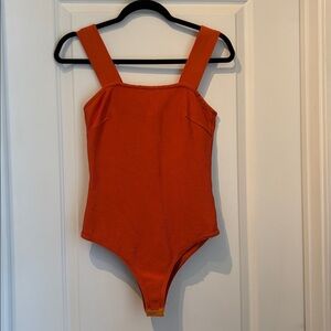 Stretchy orange body suit